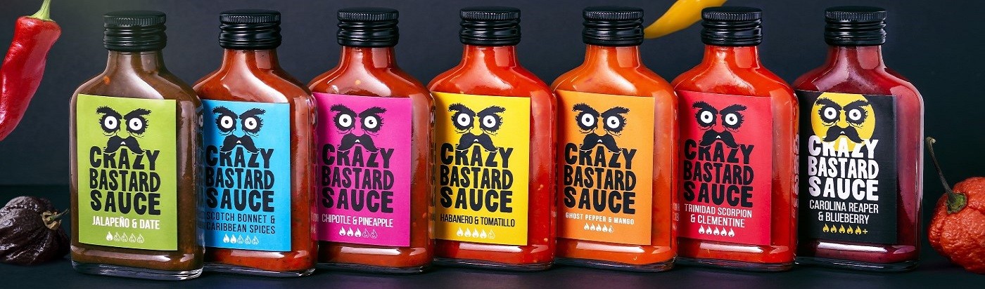 Crazy Bastard hot sauce bottles in assorted varieties